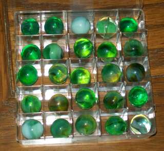 25 VARIOUS GREEN MARBLES IN PLASTIC DISPLAY CASE  