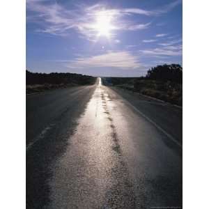 The Sun Reflects on This Black Tarred Road in Arizona National 