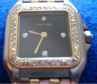   this is a superb cartier panthere watch in a rarely found black face