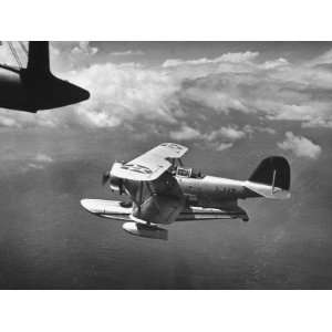  J2F Utility Plane Flying over Pacific Ocean Photographic 