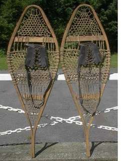 lot of snowshoes toboggans skis paddles and oars listed with a wide 