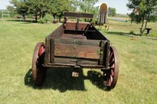 This antique horse drawn wagon is all original, with stenciling. This 